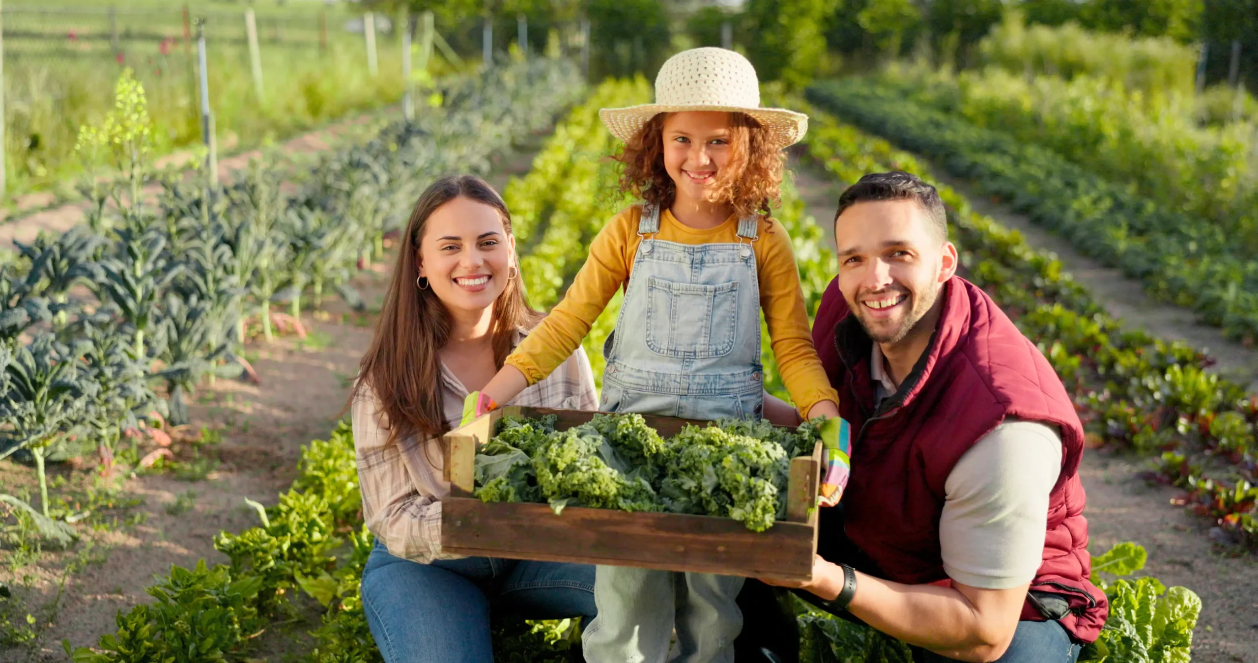 Family-owned farm with parents and child harvesting vegetables, symbolizing intergenerational succession and sustainable agriculture in European SMEs